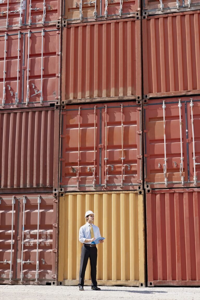 businessman with cargo containers